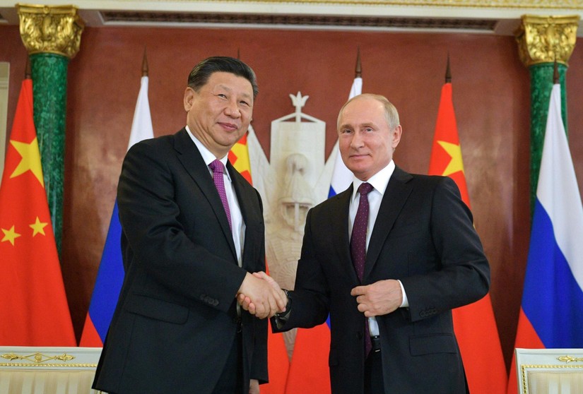 Tổng thống Nga V. Putin v&agrave; Chủ tịch Trung Quốc Tập Cận B&igrave;nh tại cuộc gặp ở Moskva. Ảnh: AFP