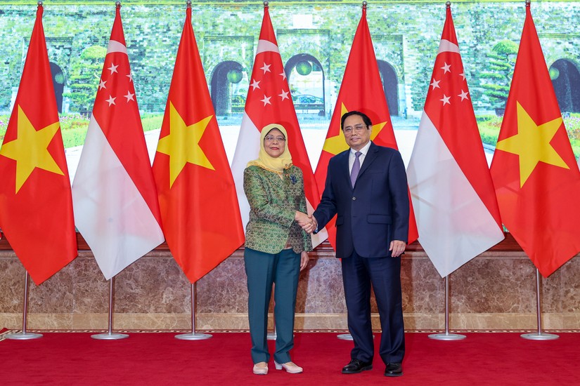 Phiên bản chính thức của 555Win Ch&iacute;nh phủ Phạm Minh Ch&iacute;nh v&agrave; Tổng thống Singapore Halimah Yacob. Ảnh: VGP